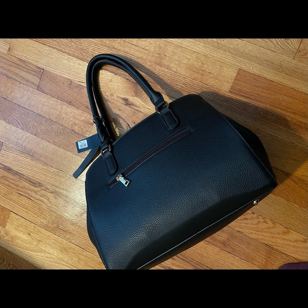Purse -Black brand new with tags. Faux leather